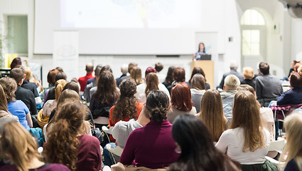 Image showing Woman giving presentation in lecture hall at university.