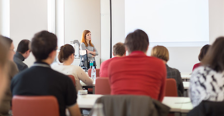 Image showing Woman giving presentation in lecture hall at university.