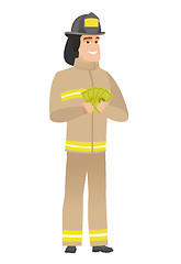 Image showing Happy caucasian firefighter holding money.