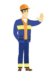 Image showing Asian builder showing stop hand gesture.