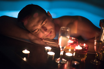 Image showing man relaxing in the jacuzzi