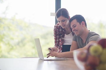 Image showing happy young couple buying online