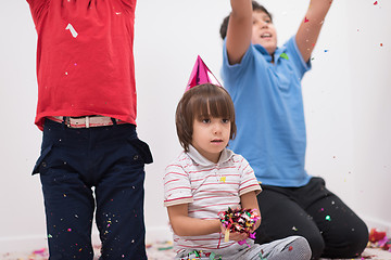 Image showing kids  blowing confetti