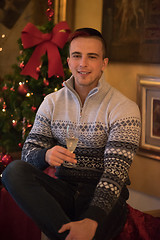 Image showing Happy young man with a glass of champagne