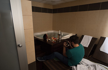 Image showing man relaxing in the jacuzzi