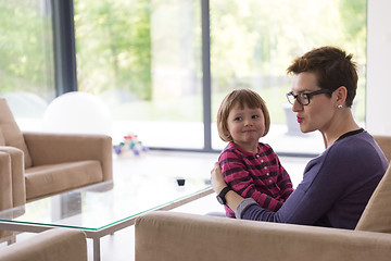 Image showing mother and cute little girl enjoying their free time