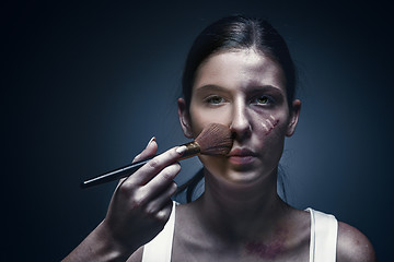 Image showing Close up portrait of a crying woman with bruised skin and black eyes