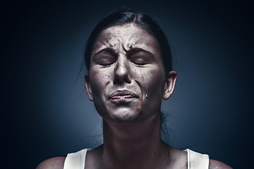 Image showing Close up portrait of a crying woman with bruised skin and black eyes