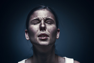 Image showing Close up portrait of a crying woman with bruised skin and black eyes