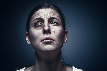 Image showing Close up portrait of a crying woman with bruised skin and black eyes