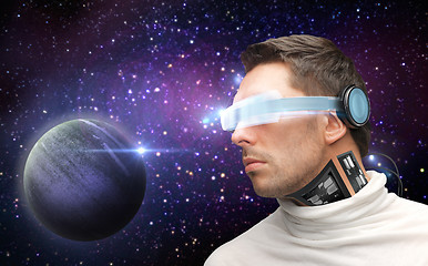 Image showing male robot in 3d glasses and sensors over space