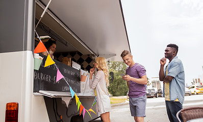 Image showing happy customers queue at food truck