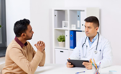 Image showing doctor with tablet pc and male patient at hospital