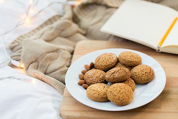 Image showing oatmeal cookies with almonds on plate at home