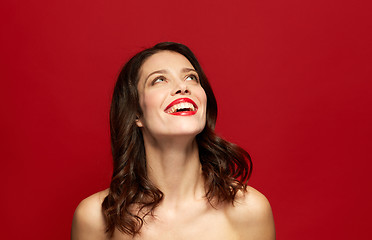 Image showing beautiful smiling young woman with red lipstick