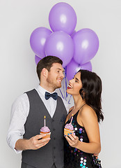 Image showing happy couple with balloons and cupcakes at party