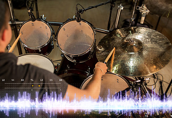 Image showing drummer playing drum kit at sound recording studio