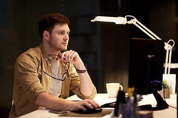 Image showing man with computer working late at night office