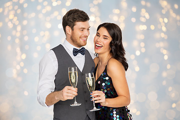 Image showing happy couple with champagne glasses at party