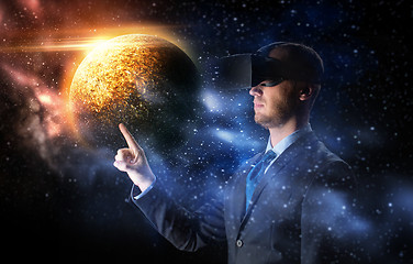 Image showing businessman in virtual reality headset over space