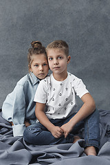 Image showing A portrait of little girl and a boy on the gray background