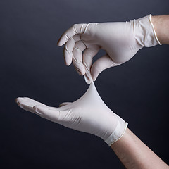 Image showing Male hands in latex gloves