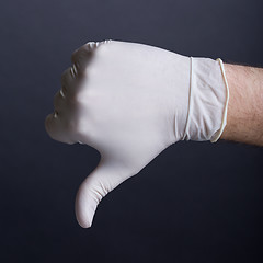 Image showing Male hand in latex glove