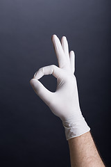 Image showing Male hand in latex glove (OK sign)