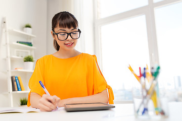 Image showing asian student girl with tablet pc learning at home