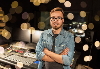 Image showing man at mixing console in music recording studio