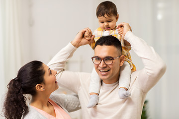 Image showing happy family and baby daughter playing at home