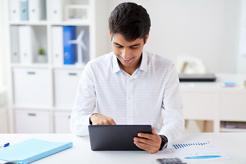 Image showing businessman working with tablet pc at office