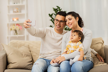 Image showing mother and father with baby taking selfie at home