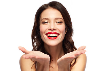 Image showing beautiful smiling young woman with red lipstick