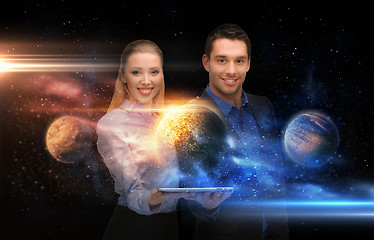 Image showing businesspeople with tablet pc and planets in space