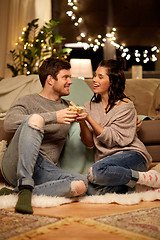 Image showing happy couple with gift box at home