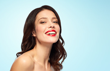 Image showing beautiful smiling young woman with red lipstick