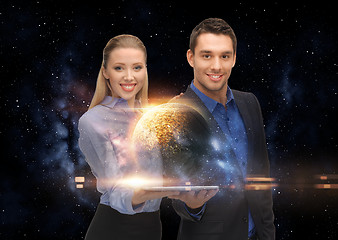 Image showing businesspeople with tablet pc and planets in space