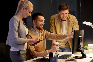 Image showing business team with computer working late at office