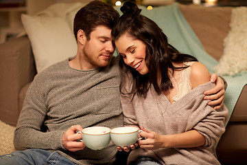 Image showing happy couple drinking cacao at home