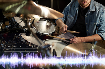 Image showing drummer playing drum kit at sound recording studio