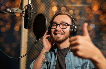 Image showing man with headphones at music recording studio