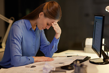 Image showing businesswoman with computer at night office