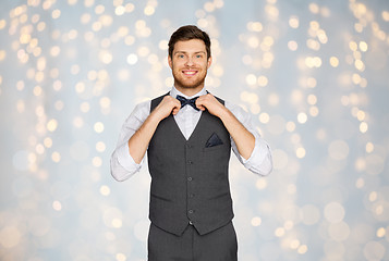 Image showing happy man in festive suit dressing for party