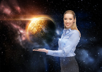 Image showing smiling businesswoman with smartphone over space