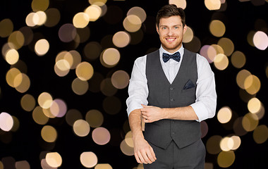 Image showing happy man in festive suit dressing for party