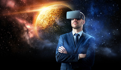 Image showing businessman in virtual reality headset over space