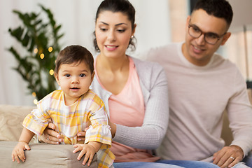 Image showing happy family with baby daughter at home