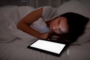 Image showing woman with tablet pc sleeping in bed at night