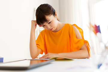 Image showing asian student girl with tablet pc learning at home